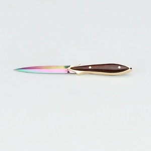 Non-aqueous colored titanium plated stainless steel tea knife