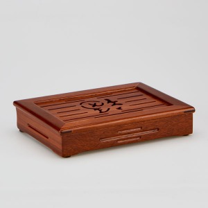 a tea board with a fine wooden pattern